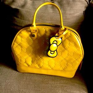 Yellow hello kitty lounge fly purse